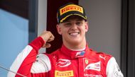 (FILES) In this file photo taken on August 4, 2019 Prema Racing's German driver Mick Schumacher celebrates after winning the Formula Two championship race of the Hungarian Grand Prix at the Hungaroring circuit in Mogyorod near Budapest./ AFP / ANDREJ ISAK