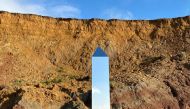 A handout picture released courtesy of the Twitter feed of @AlexiaRFishwick shows an obelisk standing on Compton Beach on the southern western coast of the Isle of Wight on December 6, 2020. AFP / @AlexiaRFishwick  