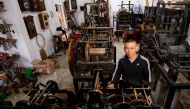 Clocks collector Pham Van Thuoc stands among old church clocks from Europe at his home in Thai Binh province, Vietnam December 6, 2020. Reuters/Kham