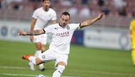 Al Sadd's Santi Cazorla shoots to score against Al Gharafa.