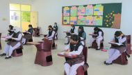 PISQ students taking exam following COVID-19 measures.