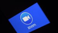 In this file photo illustration a Zoom App logo is displayed on a smartphone on March 30, 2020 in Arlington, Virginia. Zoom shares soared on August 31 after the video-meeting service reported that quarterly revenue rocketed as its ranks of users more than