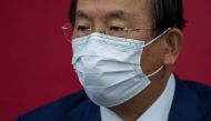 Tokyo 2020 Olympic Games CEO Toshiro Muto wears a face mask as he speaks during a press conference following a Tokyo 2020 Olympics Executive Board meeting in Tokyo on December 22, 2020. / AFP / POOL / Carl Court