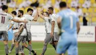 Al Sadd's players react after their Round 11 QSL match against Qatar SC on Monday.