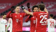 Munich, Germany - January 3, 2021 Bayern Munich's Robert Lewandowski celebrates scoring their fifth goal with Leroy Sane and Thomas Muller Pool via REUTERS/Andreas Gebert DFL regulations prohibit any use of photographs as image sequences and/or quasi-vide