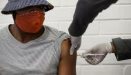 A volunteer receives an injection from a medical worker during the country's first human clinical trial for a potential vaccine against the novel coronavirus, at Baragwanath Hospital in Soweto, South Africa, June 24, 2020. Reuters/Siphiwe Sibeko/File Phot