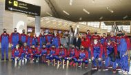 Qatar handball squad's players and officials pose for a group photo ahead of their departure to Egypt yesterday. 