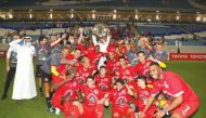 Al Duhail's players and officials celebrate with the Falcon Shield in this file photo. 