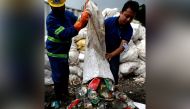 File photo: Workers from a recycling company dump garbage collected and brought from Mount Everest out of a bag, in Kathmandu, Nepal June 5, 2019. Reuters/Navesh Chitrakar/File Photo
