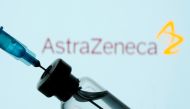A vial and sryinge are seen in front of a displayed AstraZeneca logo in this illustration taken January 11, 2021. REUTERS/Dado Ruvic/Illustration/File Photo