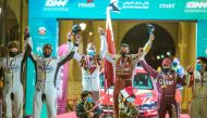 The podium winners of the Qatar International Rally, Nasser Saleh Al Attiyah, Matthieu Baumel; Abdulaziz Al Kuwari, James Fulton and Khalid Al Suwaidi and Hugo Magalhães celebrate on the podium.