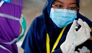 File photo: A medical worker prepares a dose of Sinovac's vaccine before giving it to a healthcare worker at an emergency hospital in the Athlete Village in Jakarta, Indonesia, January 27, 2021. Reuters/Ajeng Dinar Ulfiana/File Photo