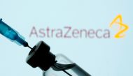 A vial and sryinge are seen in front of a displayed AstraZeneca logo in this illustration taken January 11, 2021. REUTERS/Dado Ruvic/Illustration/File Photo/File Photo