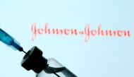 FILE PHOTO: A vial and syringe are seen in front of a displayed Johnson&Johnson logo in this illustration taken January 11, 2021. REUTERS/Dado Ruvic/Illustration/File Photo
