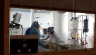 Medical staff members work in the Intensive Care Unit (ICU) for COVID-19 patients at La Timone hospital in Marseille, as the spread of the coronavirus disease (COVID-19) continues in France, February 8, 2021. REUTERS/Eric Gaillard
