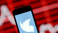The Twitter logo is shown on smartphone in front of a displayed stock graph in central Bosnian town of Zenica, Bosnia and Herzegovina, in this April 29, 2015 photo illustration. REUTERS/Dado Ruvic/File Photo