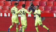 Atletico Madrid's Angel Correa celebrates scoring their second goal with Marcos Llorente and Sime Vrsaljko REUTERS/Jon Nazca