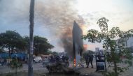 Residents set fire to mysterious monolith that appeared in Kinshasa, Democratic Republic of Congo February 17, 2021. REUTERS/Kenny Katombe
