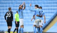 Manchester City's John Stones celebrates after the match with Ruben Dias Pool via REUTERS/Gareth Copley