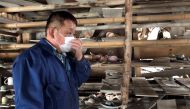 Toshiharu Onoda, 59, of the 13th generation to take on the family pottery business, looks at his studio damaged by the March 11, 2011 earthquake and tsunami, in Namie town, near the tsunami-crippled Fukushima Daiichi nuclear power plant, Fukushima Prefect