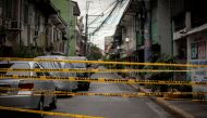 A view shows a makeshift barrier set up on a street of a village under lockdown amid rising coronavirus disease (COVID-19) infections, in Manila, Philippines, March 12, 2021. REUTERS/Eloisa Lopez