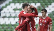 Bayern Munich's Robert Lewandowski celebrates scoring their third goal with teammate Leon Goretzka Pool via REUTERS/Fabian Bimmer