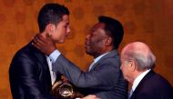 FILE PHOTO: Portugal's Cristiano Ronaldo is congratulated by Pele after being awarded the FIFA Ballon d'Or 2013 in Zurich January 13, 2014. REUTERS/Arnd Wiegmann