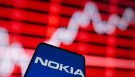FILE PHOTO: The Nokia logo is seen on a smartphone in front of a displayed stock graph in this illustration taken February 5, 2021. REUTERS/Dado Ruvic/File Photo