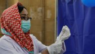 FILE PHOTO: A paramedic prepares a dose of Sinopharm's coronavirus disease (COVID-19) vaccine before administering it to a health worker at... AKHTAR SOOMRO March 18, 2021
