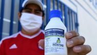 FILE PHOTO: Manuel Negrete holds the anti-parasite drug ivermectin after buying it with a medical prescription at a local pharmacy in Santa Cruz, Bolivia May 19, 2020. REUTERS/Rodrigo Urzagasti/File Photo
