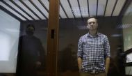 FILE PHOTO: Russian opposition politician Alexei Navalny attends a hearing to consider an appeal against an earlier court decision to change his suspended sentence to a real prison term, in Moscow, Russia February 20, 2021. REUTERS/Maxim Shemetov/File Pho