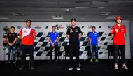 Maverick Vinales (centre, front) along with Johann Zarco, Francesco Bagnaia, defending world champion Joan Mir, Fabio Quartararo and Alex Rins, poses from a picture after a press conference at Losail International Circuit yesterday. RIGHT: Vinales gesture