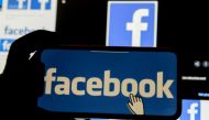 The Facebook logo is displayed on a mobile phone in this picture illustration taken December 2, 2019. REUTERS/Johanna Geron/Illustration/File Photo