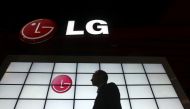 A show attendee passes by the LG Electronics booth during the 2009 International Consumer Electronics Show (CES) in Las Vegas, Nevada, January 9, 2009. REUTERS/Steve Marcus/File Photo