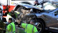 FILE PHOTO: The vehicle of golfer Tiger Woods, who was rushed to hospital after suffering multiple injuries, is loaded onto a recovery truck after being involved in a single-vehicle accident in Los Angeles, California, U.S. February 23, 2021. REUTERS/Gene