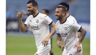 Al Sadd's Boualem Khoukhi celebrates with team-mate Guilherme after scoring their second goal yesterday