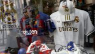 Barcelona, Real Madrid and Atletico Madrid merchandise is seen through a shop window as twelve of Europe's top football clubs launch a breakaway REUTERS/Susana Vera
