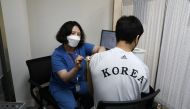 South Korean Olympic judo team player An Ba-ul receives the first dose of the Pfizer-BioNTech coronavirus vaccine at the National Medical Center in Seoul, South Korea April 29, 2021. Chung Sung-Jun/Pool via REUTERS