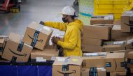 An employee scans packages at Amazon's JFK8 distribution center in Staten Island, New York, U.S. November 25, 2020. REUTERS/Brendan McDermid./File Photo/File Photo