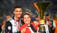  Juventus' Cristiano Ronaldo poses with his mother Maria Dolores dos Santos Aveiro as he celebrates winning Serie A with the trophy Reuters/Massimo Pinca/File Photo