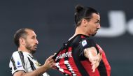 AC Milan's Zlatan Ibrahimovic in action with Juventus' Giorgio Chiellini REUTERS/Massimo Pinca