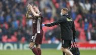 Leicester City's Jonny Evans applauds the fans as he is substituted off after sustaining an injury Pool via REUTERS/Matthew Childs