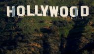 FILE PHOTO: The iconic Hollywood sign is shown on a hillside above a neighborhood in Los Angeles California, U.S., February 1, 2019. REUTERS/Mike Blake/File Photo
