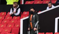 Manchester United's Harry Maguire is seen in the stands on crutches before the match Pool via REUTERS/Laurence Griffiths