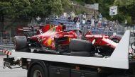 The car of Ferrari's Charles Leclerc is recovered after he crashed in qualifying Pool via REUTERS/Sebastien Nogier