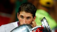FILE PHOTO: Spain's Sergio Ramos kisses the trophy after defeating Italy to win the Euro 2012 final soccer match at the Olympic stadium in Kiev, July 1, 2012. REUTERS/Kai Pfaffenbach