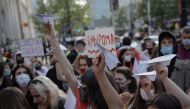 People hold paper planes during a protest against the detention of Belarusian blogger, Roman Protasevich, who was detained as a Ryanair plane that he was on, en route from Athens to Vilnius, was forced to land in Minsk on Sunday, in Warsaw, Poland, May 24