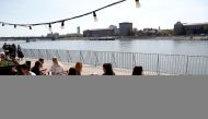FILE PHOTO: Guests enjoy the sunny weather as they sit in front of a restaurant after the Hungarian government allowed to reopen outdoor terraces, as the spread of the coronavirus disease (COVID-19) continues in Budapest, Hungary, April 24, 2021. REUTERS/