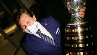 File photo of Alejandro Dominguez, president of CONMEBOL, holding the Copa America trophy. Reuters