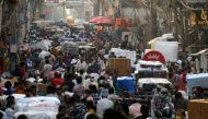 FILE PHOTO: People walk at a crowded market in the old quarters of Delhi, India, April 6, 2021. REUTERS/Anushree Fadnavis/File Photo
